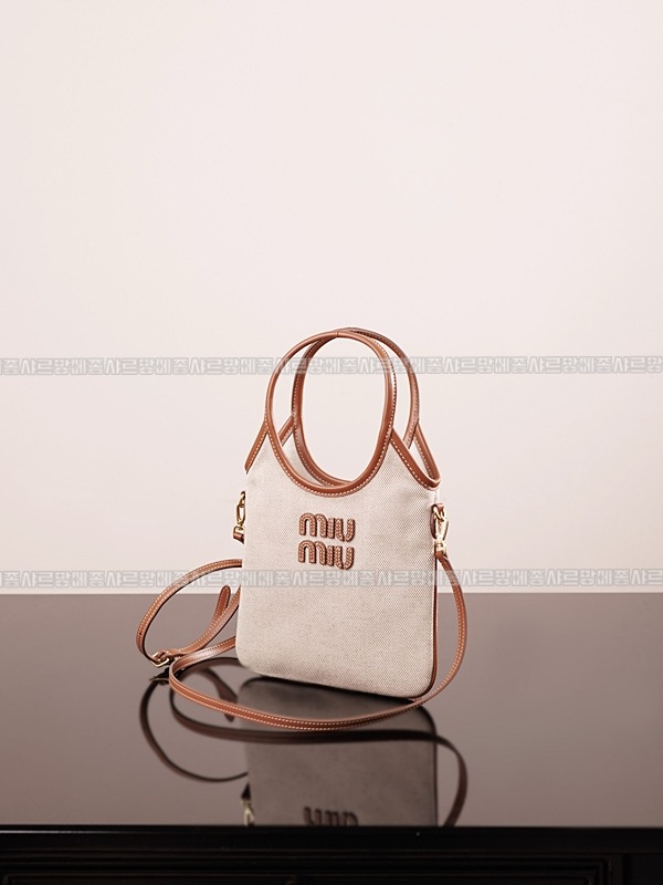 미우미우아이비캔버스토트백 20260315-125445-001루.jpg