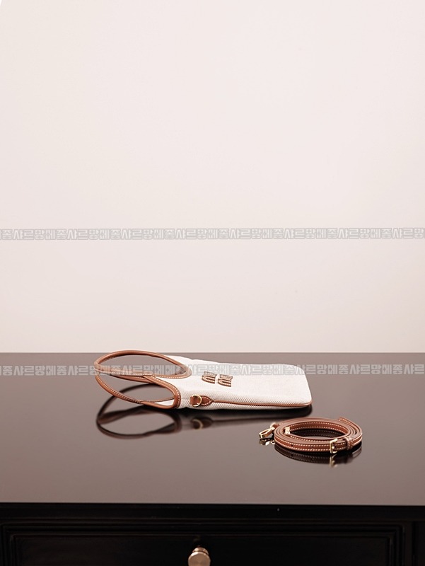 미우미우아이비캔버스토트백 20260315-125446-006루.jpg