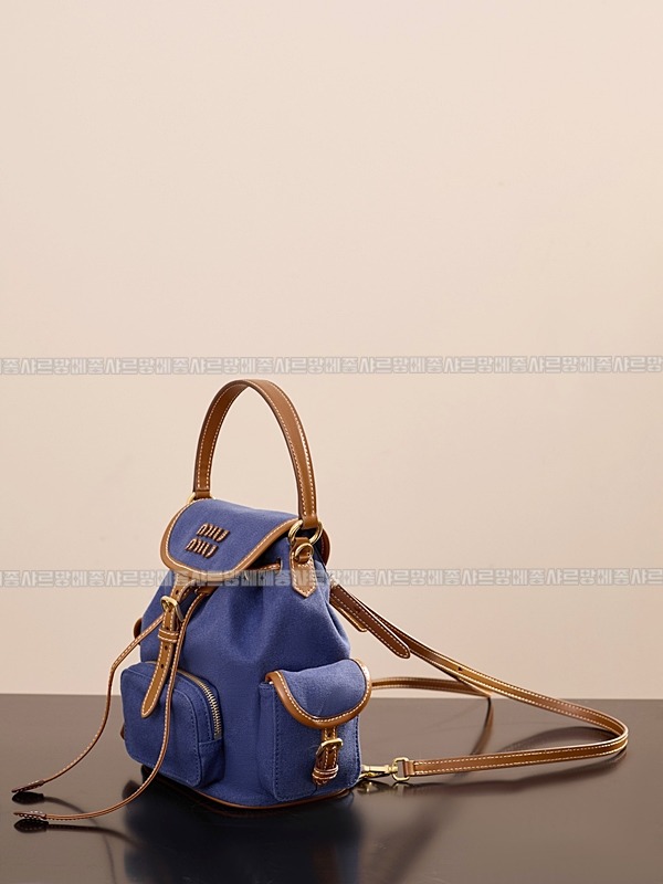 미우미우켄버스및가죽백팩 20260315-133113-002루.jpg